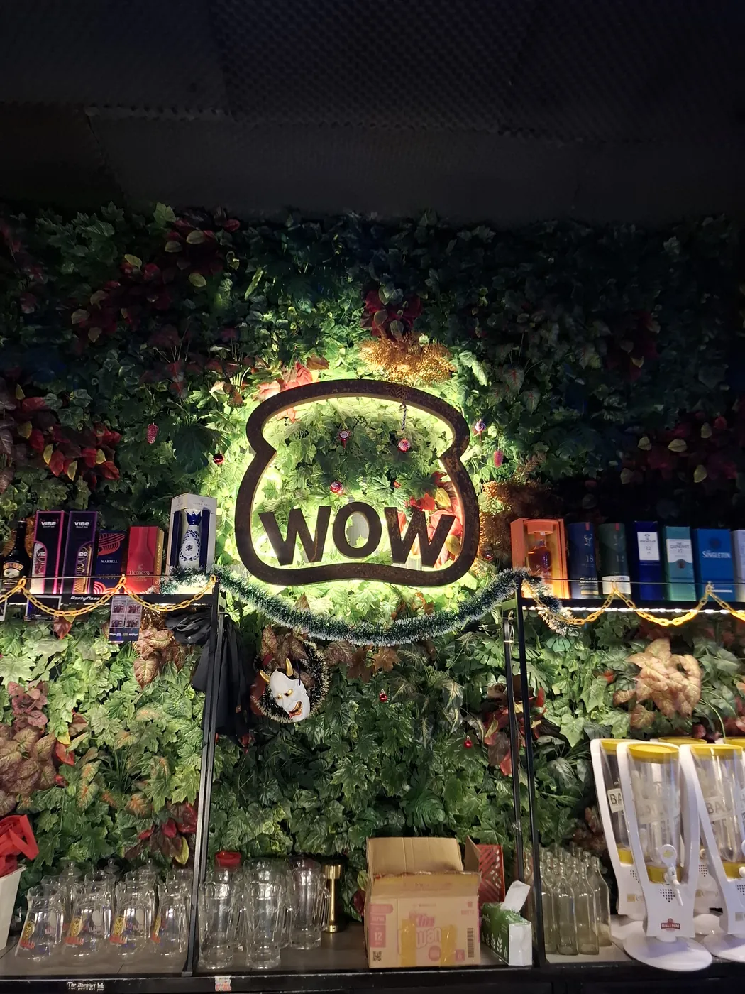 The illuminated WOW sign at Warunk WOW in Bali
