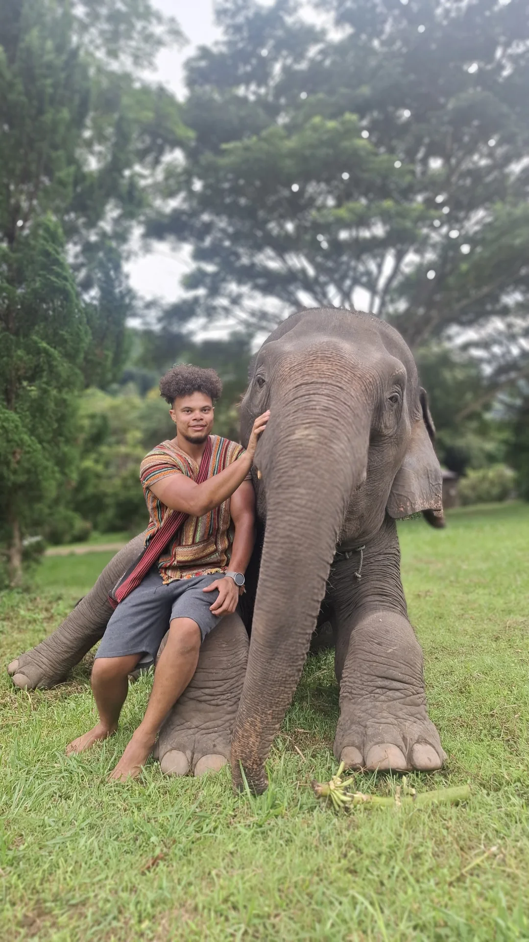 Dainyel beside an elephant in Thailand