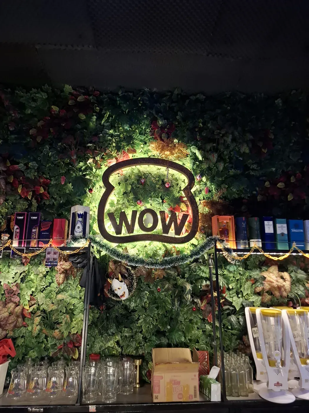 The illuminated WOW sign at Warunk WOW in Bali