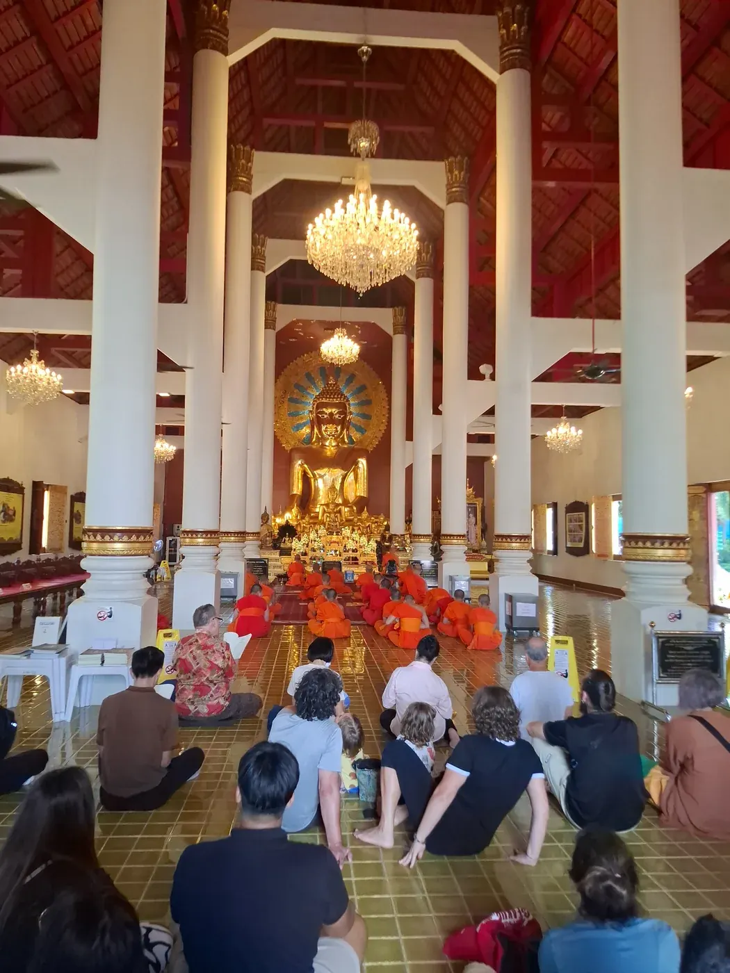 Monks gathered inside a Thai temple